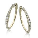 Dress up your classic button down with these 18K white gold hoops featuring .97cttw diamonds.