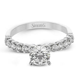 18K diamond engagement ring 0.50 ctw., features a half bezel setting on each individual side diamond which adds a modern bubble look to this ring