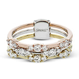 This three row ring gives the look of stacked bands but the comfort and security of one ring.  Created in 18k white, yellow and rose gold and featuring .65cttw diamonds, this ring pairs perfectly with any look.