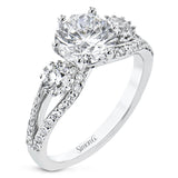 This 3 stone engagement ring has a split shank design and 2 side diamonds 1/4 ct each, totaling 0.48 ctw. and outlined with diamond accents of .35 ctw.