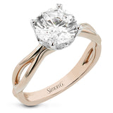 Simplicity meets modern in this two-tone engagement ring with a yellow gold split shank, and diamond accent lower halo 0.04 ctw set in white gold