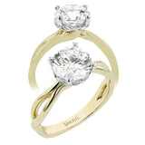 Simplicity meets modern in this two-tone engagement ring with a yellow gold split shank, and diamond accent lower halo 0.04 ctw set in white gold