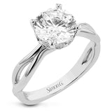 Simplicity meets modern in this two-tone engagement ring with a yellow gold split shank, and diamond accent lower halo 0.04 ctw set in white gold