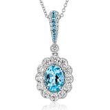 This gorgeous white gold pendant features a beautiful oval paraiba tourmaline center, surrounded by a scalloped halo of diamonds 0.48 ctw, with a sprinkling of round paraibas 0.04 ct on the bail.