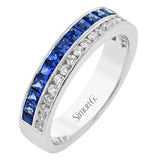 This white gold right hand ring sparkles with two rows of gems. A row of white diamonds 0.27 ctw, and a row of blue sapphires 0.97 ctw. Accented by a delicate beaded edge.