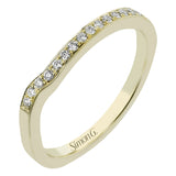 Contemporary 18 kt two-tone engagement ring has a swirl of white diamonds .24 ctw, set in yellow gold on a polished white gold shank