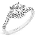 Contemporary 18 kt white gold engagement ring has a subtle knife edge and 2 diamonds of .21 ctw flanking the center, accented with a swirl of round diamonds .27 ctw