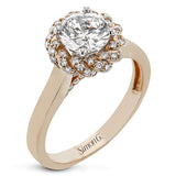 An 18k engagement ring with a new take on the classic solitaire design, features a twisted diamond halo 0.31 ctw., and high polished yellow band