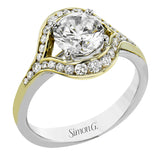 This modern two-tone engagement ring features a uniquely shaped halo with round diamonds of 0.39 ctw.