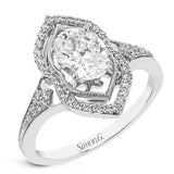 A unique art deco style engagement ring in two-tone 18K gold accented by 0.21 ctw. of round diamonds