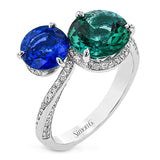 Double with fun with this dynamic duo of exquisite cool-toned gems in this 18k white gold ring: A 1.57 ct blue sapphire and a 2.43 green tourmaline.