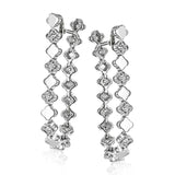 These versatile earrings can be worn in two ways, transforming from a line of diamonds into soft hoops. They're perfect for going from day to night.