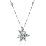 Dazzling diamonds are arranged to form this elegant floral design pendant, on a diamond station necklace 0.58 ctw.