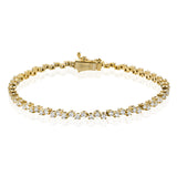 A modern take on the diamond tennis bracelet, in 18K yellow gold with 2.0 ctw of white diamonds adds a touch of sparkle to any outfit.