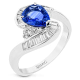 This unique right hand ring set in platinum features a shimmering pear shaped sapphire center 1.64 ctw., a round diamond .014 ctw. and swirls of diamond baguette accents 0.37 ctw.