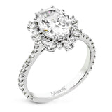 A geometric halo of diamonds in this Supernova Collection engagement ring replicates the effect of a thousand stars.