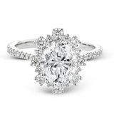 A geometric halo of diamonds in this Supernova Collection engagement ring replicates the effect of a thousand stars.