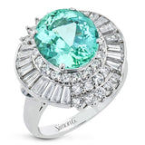 This stylish cocktail ring in platinum, features a round green tourmaline center 4.80 ctw., surrounded by a halo of round diamonds 1.0ctw., then an outer halo of baguette diamonds 1.32 ctw.