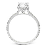 Part of our Underhalo Collection, this engagement ring contains the perfect touch of white diamonds that wink from underneath the center stone setting as well as down the sides of the ring.