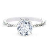 Part of our Underhalo Collection, this engagement ring contains the perfect touch of white diamonds that wink from underneath the center stone setting as well as down the sides of the ring.