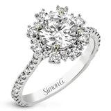 From our Super nova collection this 18K engagement ring is a unique take on the classic halo ring, and features 0.60 ctw of round diamonds