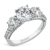 This impressive three stone ring design features a full 1ct total diamond weight on the sides of the center stone, along with .33 ctw of diamonds extending down the sides of the ring.