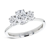 This 18k white gold engagement ring is a updated take on a classic three stone design, this time rendered with three sparkling oval shaped diamonds.