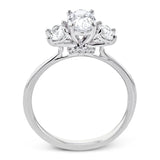 This 18k white gold engagement ring is a updated take on a classic three stone design, this time rendered with three sparkling oval shaped diamonds.