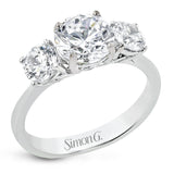 This remarkable engagement ring is our take on a classic three stone, with an intricate side design and 1.00 ctw side diamonds.