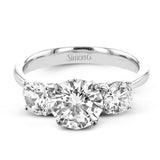 This remarkable engagement ring is our take on a classic three stone, with an intricate side design and 1.00 ctw side diamonds.