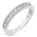 This sleek anniversary band features brilliant baguette cut diamonds 0.56 ctw., set with a delicate millgrain edge from our Simon set collection