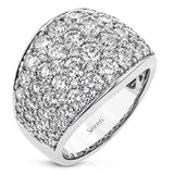 A stunning anniversary ring in 18 kt white gold, with 4.09 ctw. of round brilliant diamonds from our exclusive round Simon set collection