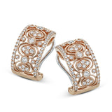 These stunning 0.70 ctw earrings in 18K yellow gold have a Byzantine quality and feature diamonds encircled in textured gold orbs, and framed by prong set diamonds.