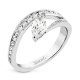 A marquise diamond set at an angle creates a contemporary look in this wonderful ring from our Lightning Collection.