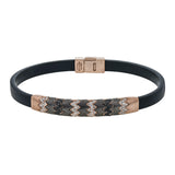 This men's bracelet features a pattern made from 14k yellow gold and titanium set with .57 ctw of black diamonds.