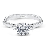Diamond side stones, milgrain and diamond detailing on the sides of the ring add to the beauty of this unique engagement ring.