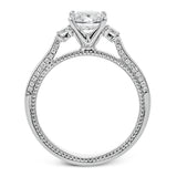 Diamond side stones, milgrain and diamond detailing on the sides of the ring add to the beauty of this unique engagement ring.