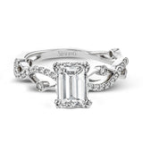 This distinctive, dynamic ring with an intertwined design is specially crafted for an emerald shaped center stone.