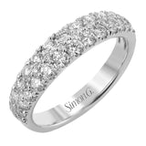 Shining white diamonds encircle the center stone in this Underhalo engagement ring, while also extending across the sides of the ring to ensure it glitters from all directions.