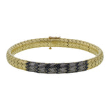 This 14k gold and titanium bracelet contains .67 ctw of black diamonds for the perfect edgy touch.
