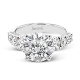 This bold 18K diamond engagement ring features 1.30 ctw of graduated round diamonds along the top & sides