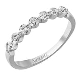 The perfect compliment to a solitare, this 7-stone diamond wedding band in 14K white gold adds just the right amount of sparkle
