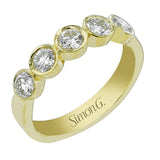 The perfect compliment to a solitare, this 7-stone diamond wedding band in 14K yellow gold adds just the right amount of sparkle