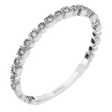 This diamond band in 14K white gold doubles as a stackable ring or a wedding band with 0.09 ctw of diamonds