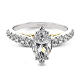 A touch of 18k yellow gold filigree on the interior of this ring adds a special touch to this 18k white gold engagement ring made for a marquise shape center stone.