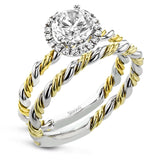 This ring is a twist on a halo engagement ring, with 18k yellow and white gold intertwining in the band.