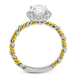 This ring is a twist on a halo engagement ring, with 18k yellow and white gold intertwining in the band.