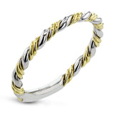 This ring is a twist on a halo engagement ring, with 18k yellow and white gold intertwining in the band.