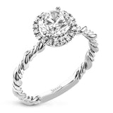 This ring is a twist on a halo engagement ring, with 18k yellow and white gold intertwining in the band.