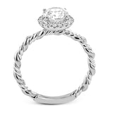 This ring is a twist on a halo engagement ring, with 18k yellow and white gold intertwining in the band.